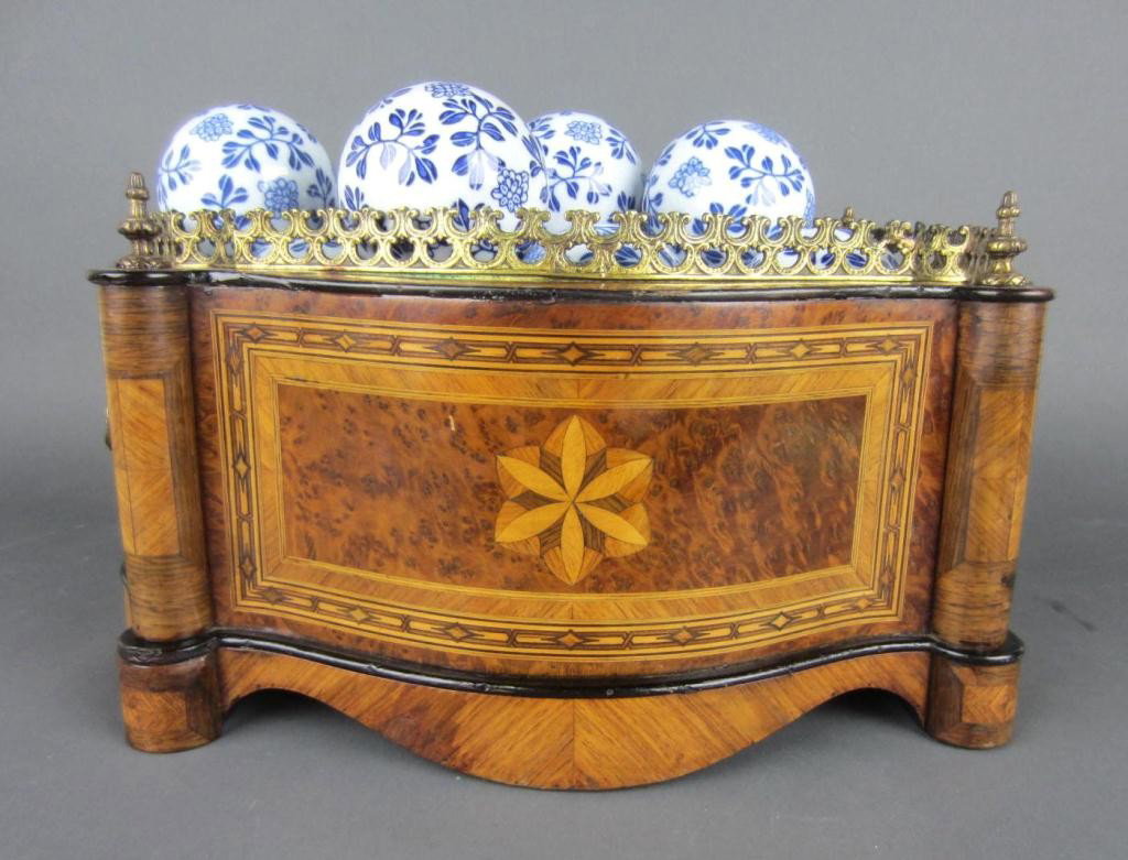 CONTEMPORARY INLAID AND BURLWOOD PLANTER: brass mounted, 8.5x18in., together with 20+ Delft-style porcelain balls
