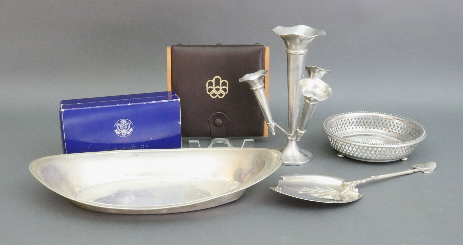 (7) PIECE SILVER TABLEWARE AND COIN GROUP: tablewares include a Tiffany sterling epergne stamped 'Made in England for Tiffany & Co.' (monogrammed, slight dent to foot and lacking base cap), central trumpet surrounded by three smaller trumpets,