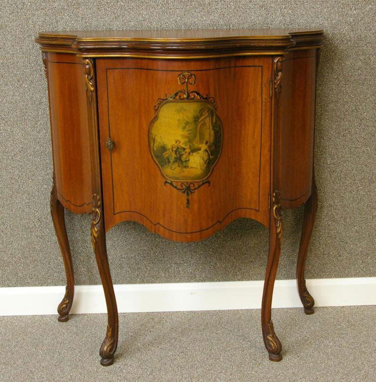MAHOGANY SERPENTINE BAR CABINET: with Watteau-style transfer scenic panel within a painted bow and swag surround, painted ebony banding, on slight cabriole legs, 31x29x15in.