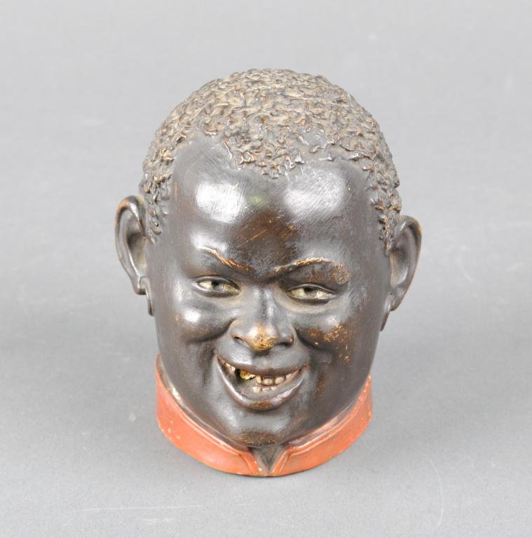 BLACK AMERICANA HUMIDOR BY BERNARD BLOCK: in terra cotta depicting a male head with hole in mouth for cigar, signed BB 4761, 3.5in.