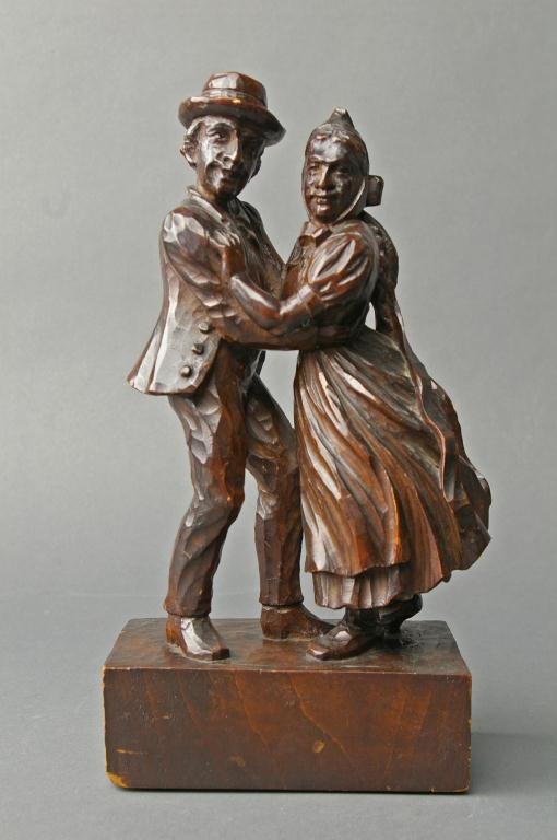 GERMAN BLACK FOREST CARVING OF A DANCING COUPLE: on square plinth, 10in.