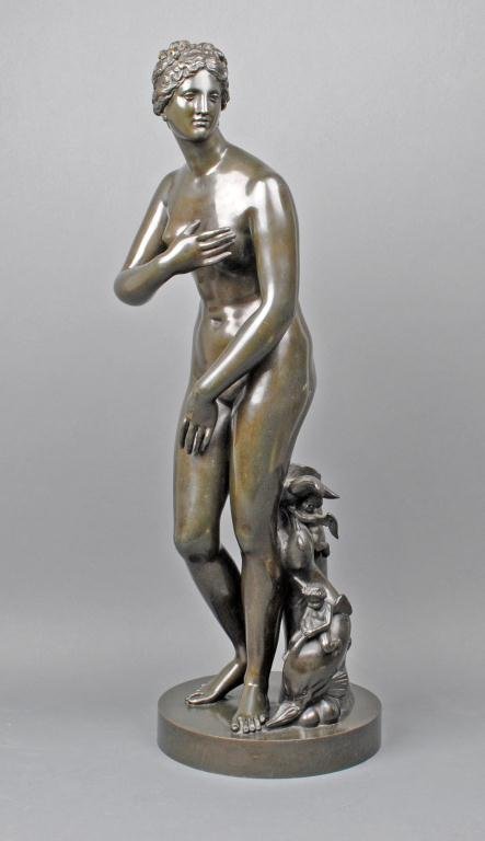 BRONZE SCULPTURE DEPICTING A CAPITOLINE VENUS: likely "Venus de Medici", standing aside a tree trunk with two winged cherubs astride a dolphin, stamped "Elkington.&.Co., Founders", green and brown patina, minor rubs, 30in.