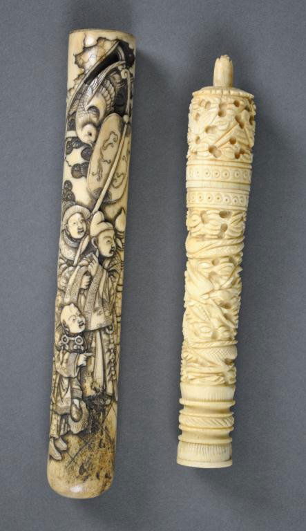 TWO ASIAN CARVED IVORY ARTICLES: including a heavily detailed and scrimshawed parasol handle, and a needle case with needles, minor thread losses on case, longest 6.5in. NO INTERNATIONAL SHIPPING.