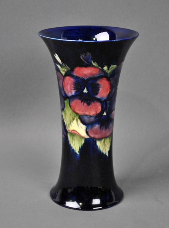 TALL MOORCROFT PANSY TRUMPET VASE: deep cobalt ground, impressed mark, painted signature in blue, 12in.