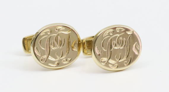 PAIR KURT WAYNE 14K LADIES CUFFLINKS: of oval form, initialed, in yellow gold, stamped 'KW 585 144855', gross weight 11.4gms. (including spring)