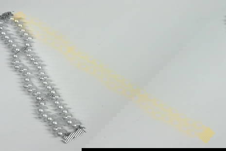 18K MIKIMOTO PEARL BRACELET: 2-strand, comprising (6.4-6.8mm) cultured pearls, yellow gold clasp stamped 750, and with M logo, purchased Mikimoto Co., Fifth Ave., New York, 7.25in., Opening Bid $200