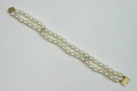 18K MIKIMOTO PEARL BRACELET: 2-strand, comprising (6.4-6.8mm) cultured pearls, yellow gold clasp stamped 750, and with M logo, purchased Mikimoto Co., Fifth Ave., New York, 7.25in., Opening Bid $200