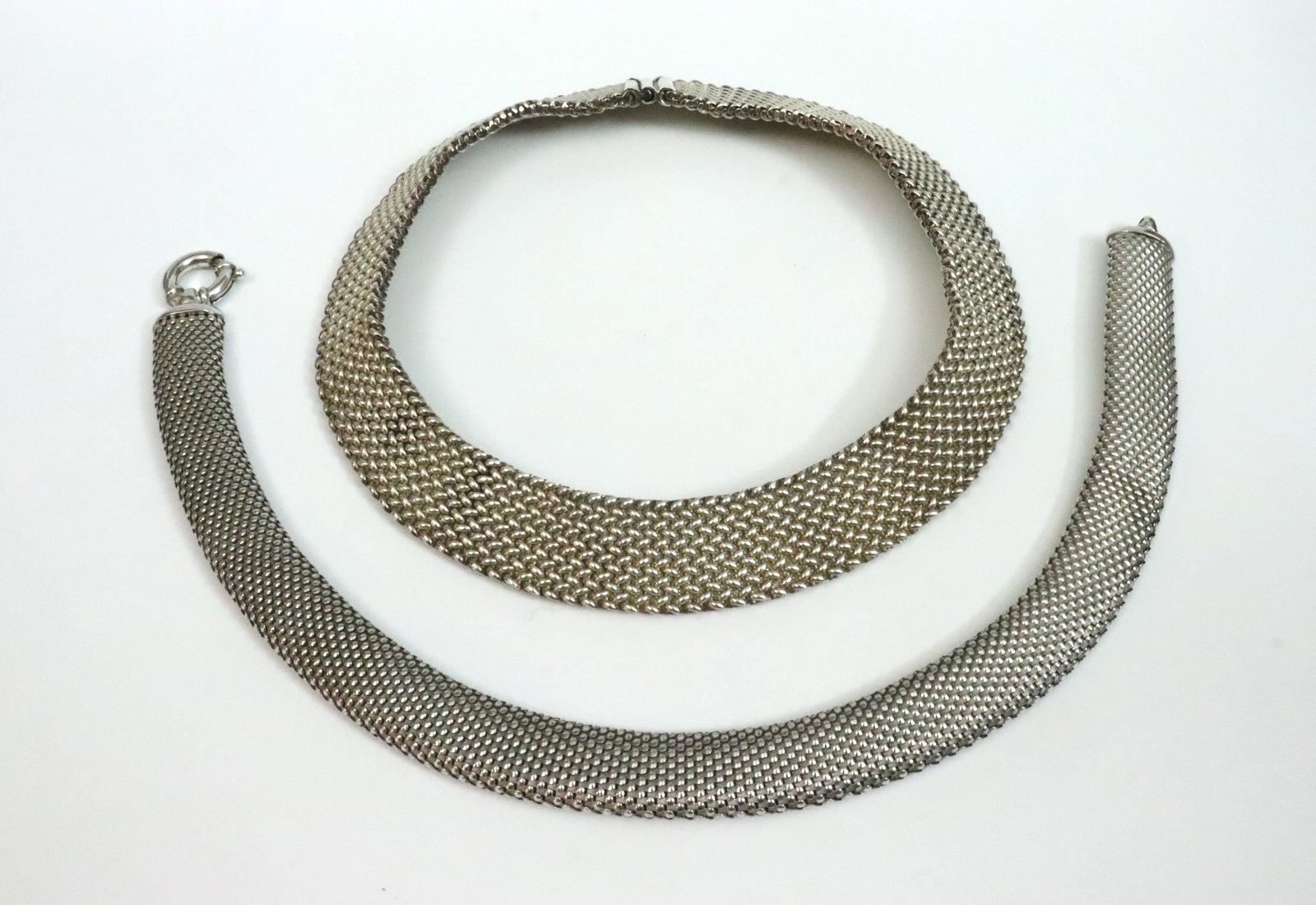 (2) ITALIAN STERLING CHOKERS: one a mesh example with slight flexibility, 16in., the other with safety catch, approx. 15in., each with width of 18in., both stamped 'Italy 925', gross weight 8.9ozt.