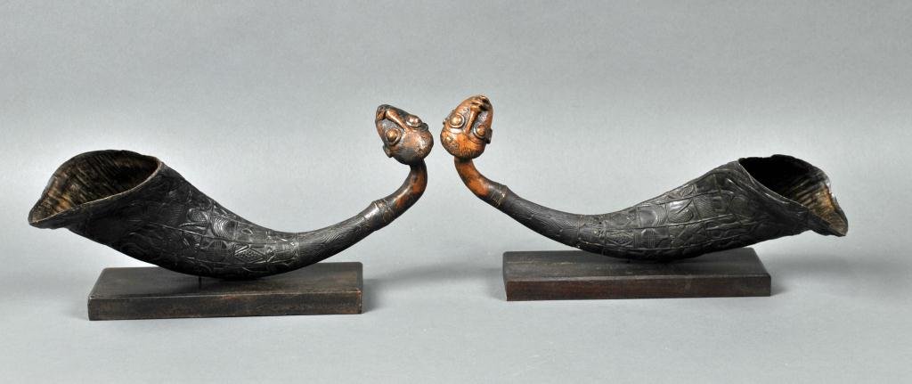 PAIR ANTIQUE AFRICAN CARVED HORN DRINKING CUPS: probably water buffalo, with later bronzed metal figural spouts, mounted on wood base, overall length 7x14in.
