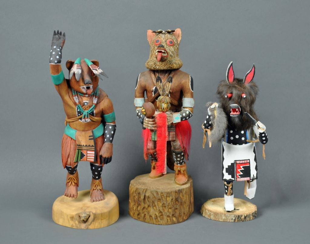 THREE HOPI KACHINA DOLLS: one signed Watson Namoki and monogrammed WN, one inscribed "Wolf Kachina / Everett Tawahogva", and one inscribed "Wolf Man by Largo", c.1960's, tallest 15in.