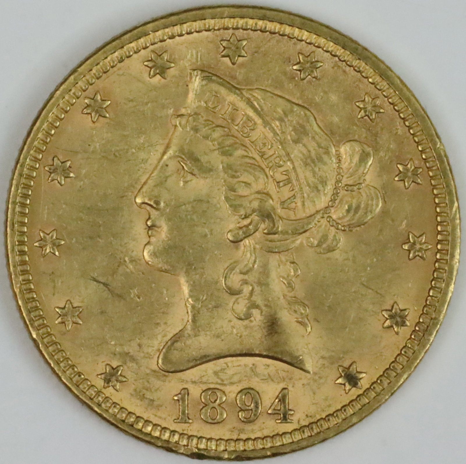 1894 $10 LIBERTY HEAD GOLD COIN: coin is 0.900 purity, 16.71gms., ungraded, likely AU-53+, (see images), Opening Bid $600