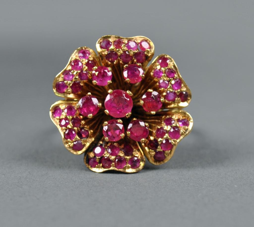 GOLD AND RUBY CLUSTER RING, 2.00CTW: c.1960, set with 49 round rubies approx. 2.00 carats, yellow gold flower-form setting tests 18K, 11.5gms.