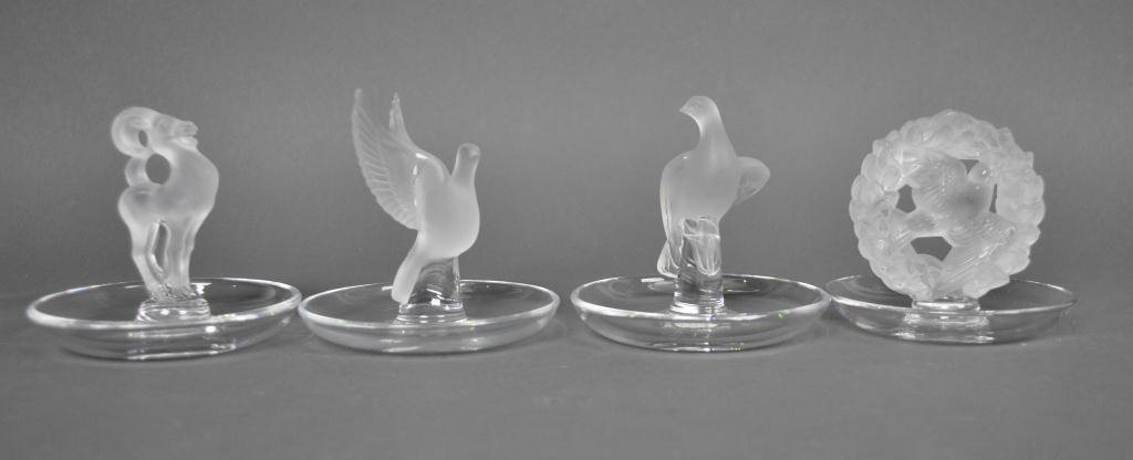 FOUR LALIQUE RING TRAYS: each signed 'Lalique France', tallest 3.5in.