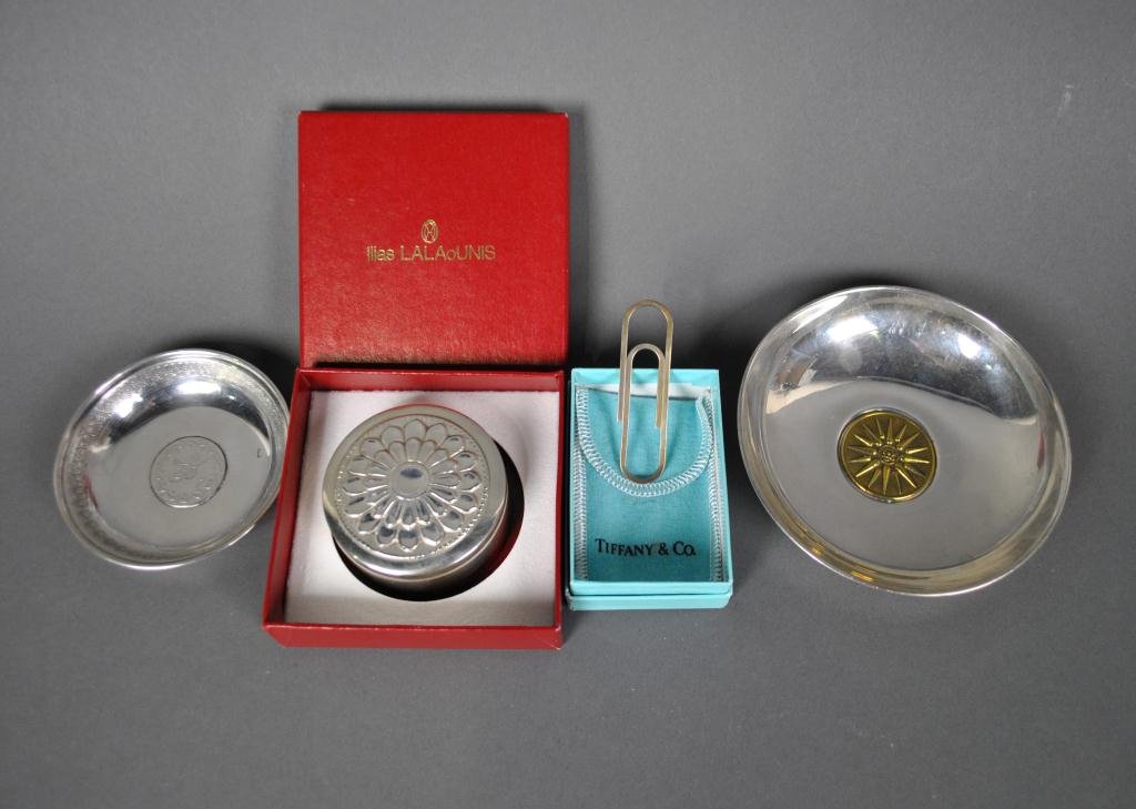 4-PIECE STERLING GROUP INCL TIFFANY & LALAOUNIS: includes a Tiffany paperclip-form money clip, an Ilias Lalaounis Byzantine-inspired box, and two medallion dishes, 5.2ozs.