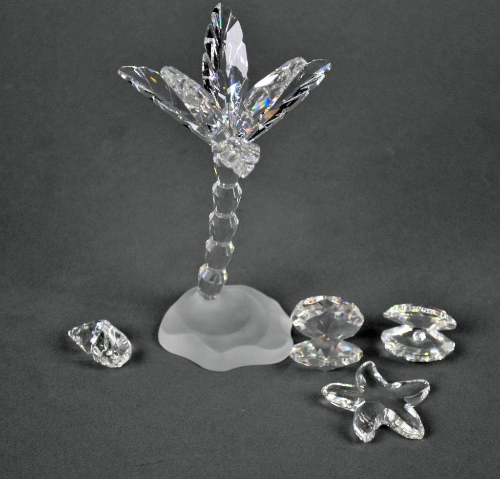 5-PIECE SWAROVSKI BEACH-THEMED GROUP: including a palm tree and four shells, tallest 5.5in.