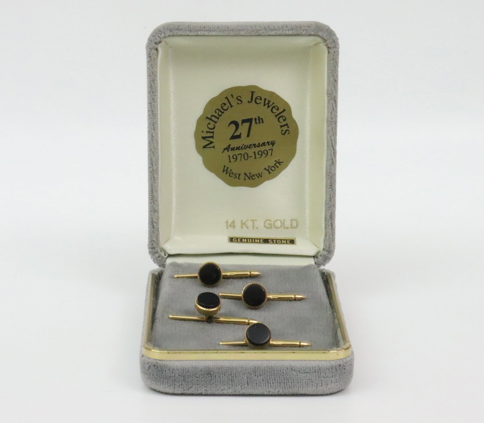 BOXED SET OF 14K ONYX SHIRT STUDS: comprising a set of 4 sliding-pin shirt studs, each set with an onyx or similar stone, overall stud diameters 8mm, all stamped 14K, gross weight 6.2gms.