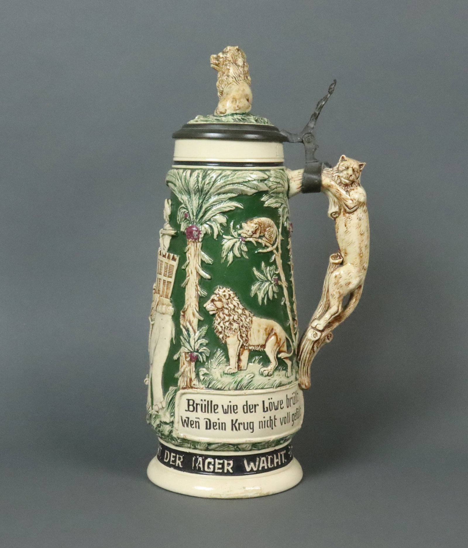 GERMAN TALL TEDDY ROOSEVELT SAFARI STEIN: c.1910, 1.5L, modeled depicting scenes from Roosevelt's 1909 safari sponsored by the Smithsonian Institution and the National Geographic Society, depicting Roosevelt atop an elephant, with allover fel