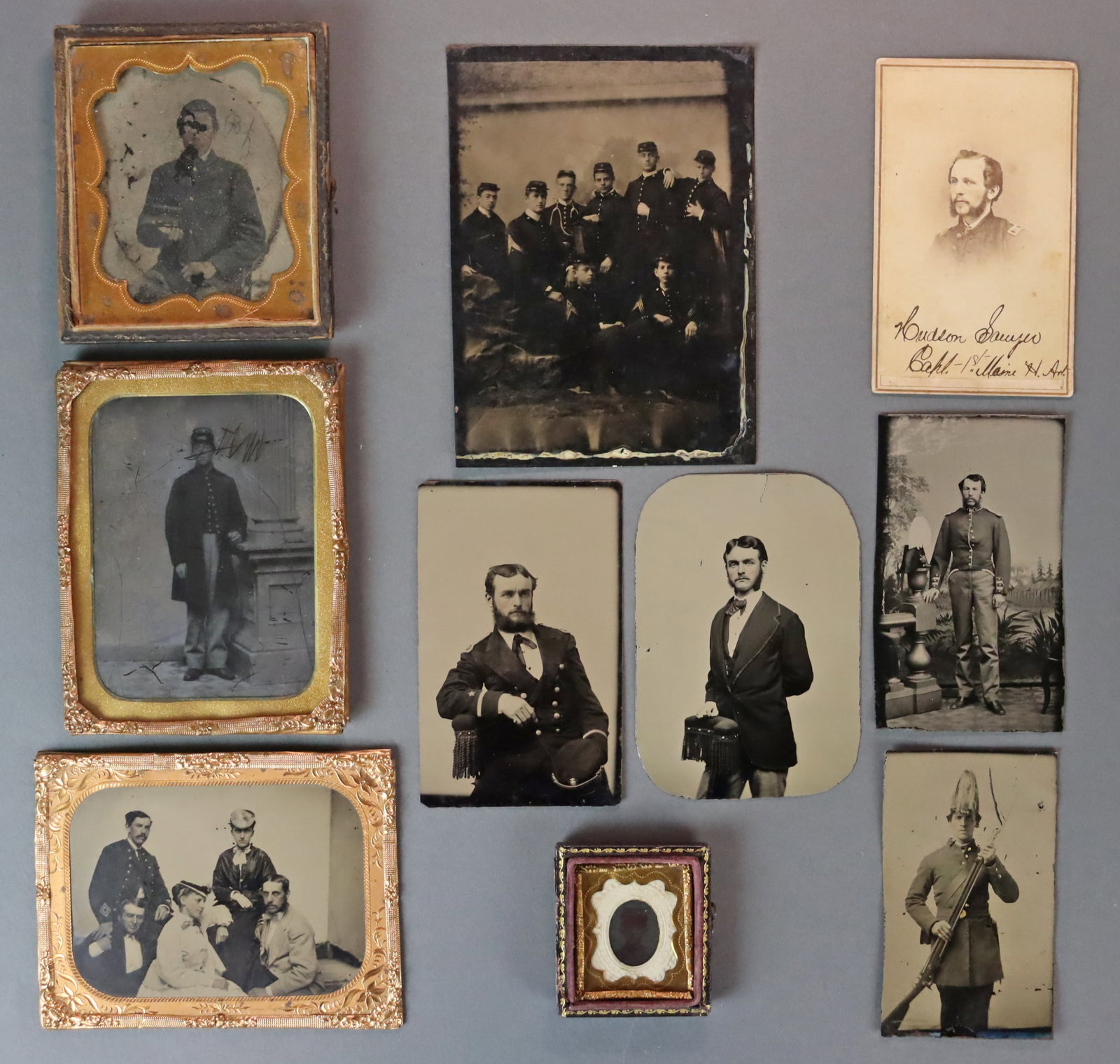 (10) EARLY PHOTOS OF CIVIL WAR SOLDIERS: Comprising 7 tintypes and 2 ambrotypes half cased and uncased in various sizes from gem-size to half plate, and a CDV, images include a group of 8 soldiers, a standing soldier in a plumed hat holding 