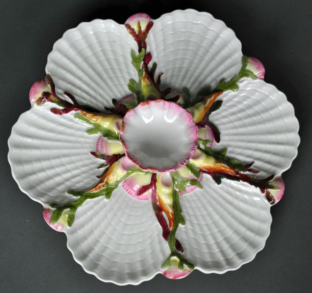 GEORGE JONES MAJOLICA OYSTER PLATE: in shell and floral motif, with impressed mark, #6925, hairline cracks across base (not visible to front), 10in.