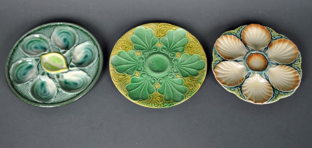 THREE FRENCH MAJOLICA OYSTER PLATES: including one by St. Clement, one by Sarreguemines, and one with impressed mark S1, 10in.