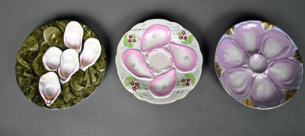 THREE HAND-PAINTED OYSTER PLATES: including Carl Tielsch (paint rubs and minor rim chips to underside of base), and two reproduction plates after Limoges and Nippon, largest 9in.
