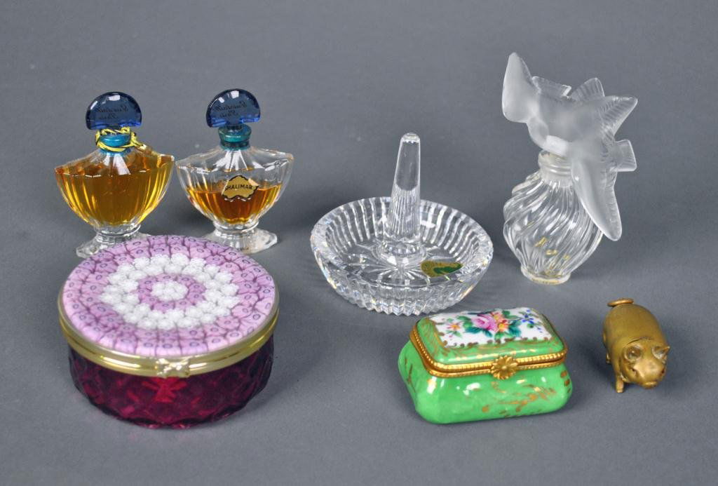 7-PIECE VANITY AND OBJECTS GROUP: includes a Lalique scent bottle with dove-top stopper, a Waterford ring holder, a Limoges hinged box, two Guerlain perfumes (lacking labels), a Venetian dresser jar, and a brass pig vesta case with re