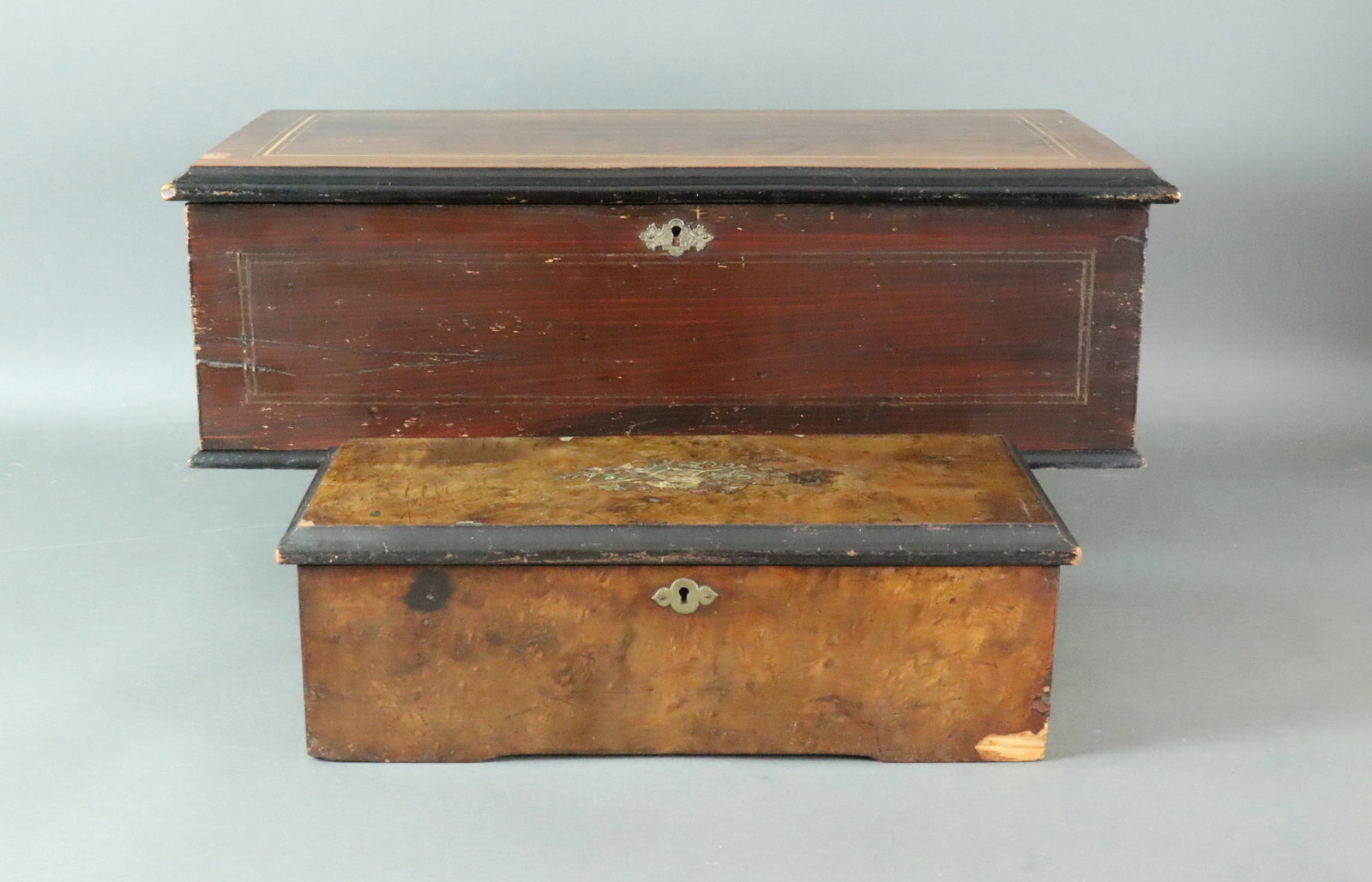 (2) VINTAGE SWISS CYLINDER MUSIC BOXES: including a Charles Ullmann 7.5in. cylinder with 20 airs, mahogany lid with inlay stringing, wood-grain painted four side panels, blank 'Qualite Excelsior' programme card, winds and runs well with all