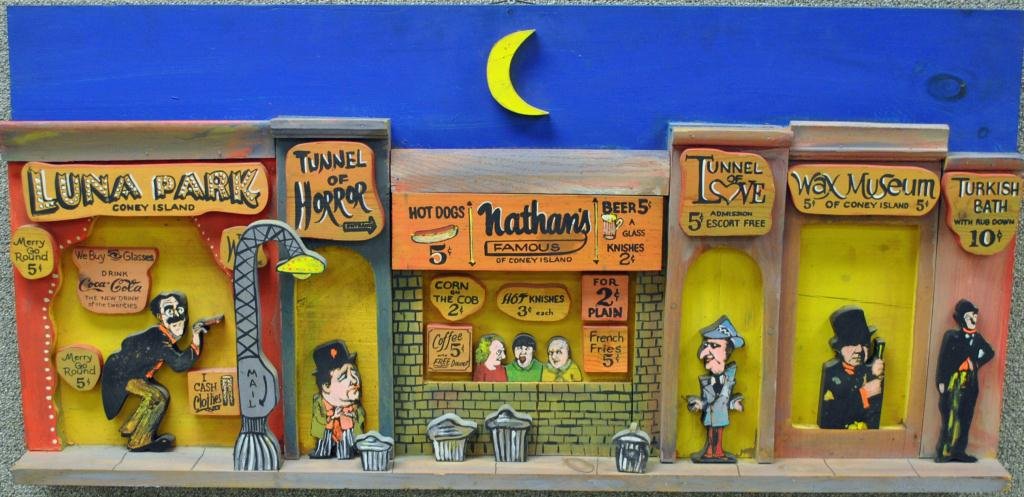 HARRY GLAUBACH (New York, b.1939): "The Past was Beautiful", 1981, carved and painted wood sculpture, depicting Coney Island with Groucho Marx, Charlie Chaplin, Abbott & Costello, Three Stooges and W.C. Fields, signed "Harry Glaubach O