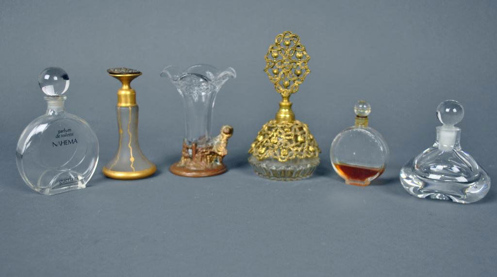 6-PIECE PERFUME AND VANITY GROUP: including De Vilbiss bottle (lid top detached), Guerlain parfum de toilette Nahema, Orrefors, Nina Ricci Lalique, a figural metal-mounted bud vase, etc.