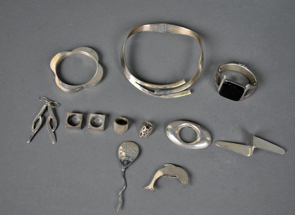 12-PIECE MEXICAN STERLING JEWELRY GROUP: including a choker, bracelet with large black stone, bangle bracelet, four pins, four rings, and a pair of earrings, 11.3ozs. gross weight