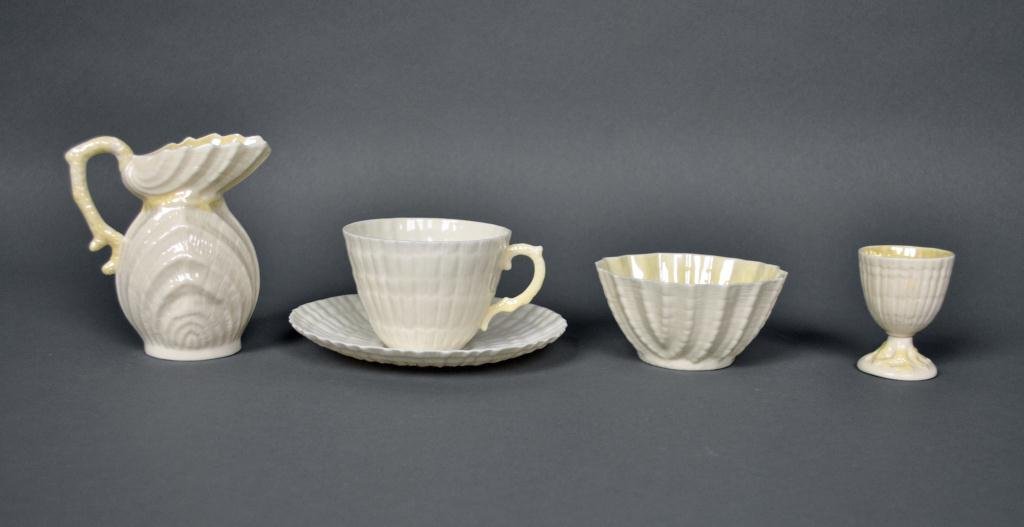 4-PIECE IRISH BELLEEK PORCELAIN GROUP: including a cream pitcher, an egg cup, a cup & saucer, and a bowl, tallest 4in.