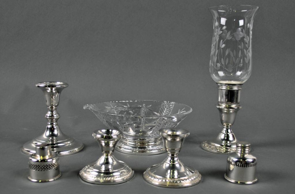 8-PIECE SILVER GROUP: comprising four weighted candle holders (including a 5" example by Black, Starr & Frost), a sterling-based glass candy dish, and three candle cup inserts, all marked Sterling