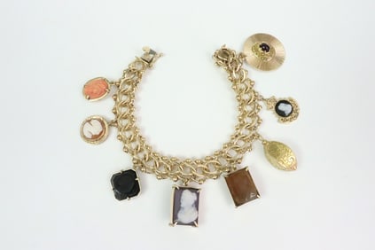 14K CHARM BRACELET WITH (8) 14K CHARMS