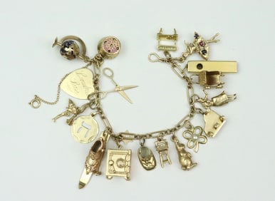 14K CHARM BRACELET WITH (19) GOLD CHARMS