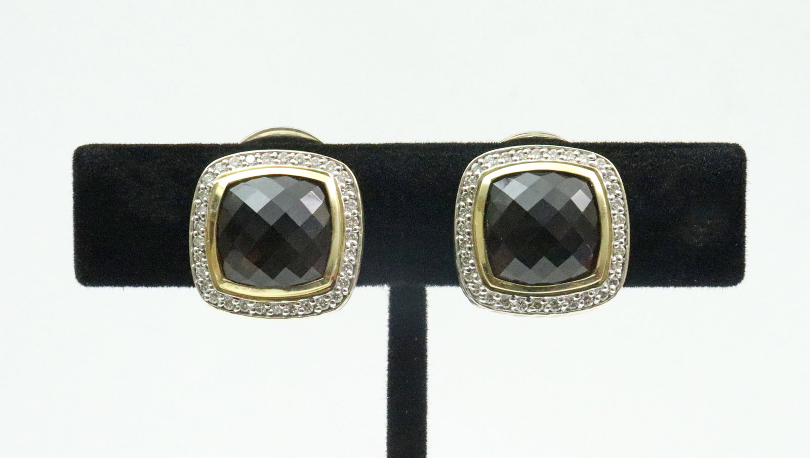 DAVID YURMAN 925/750 SMOKY QUARTZ & DIAM EAR CLIPS: each with cushion cut faceted stone bordered by diamond melee, overall 16x17mm, stamped 'D.Y. 925 750', gross weight 16.8gms., Opening Bid $200