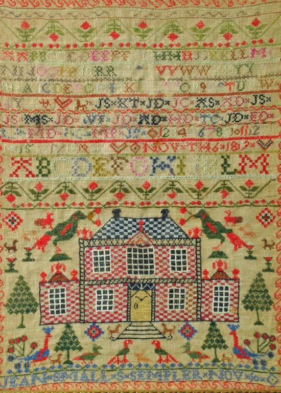 JEAN SMALL'S 1819 NEEDLEWORK SAMPLER: depicting a brick home, birds, peacocks, pets and florals, reads "Jean Smalls Sempler Nov", and date appears to be 1819, some thread fading and staining, framed, 17x12in.