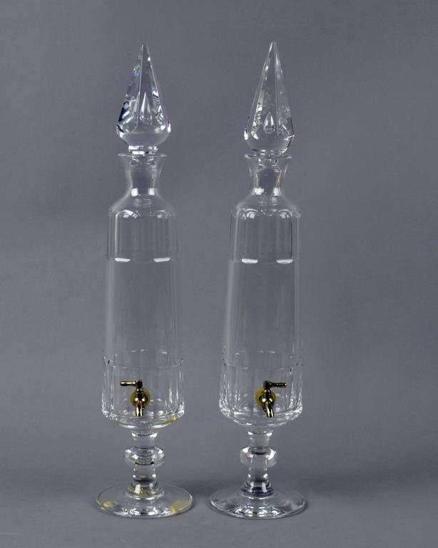 PAIR VAL ST. LAMBERT FOOTED DECANTERS WITH SPIGOT: paneled motif, wafer stem, 21in., together with a set of six etched glass brandy snifters
