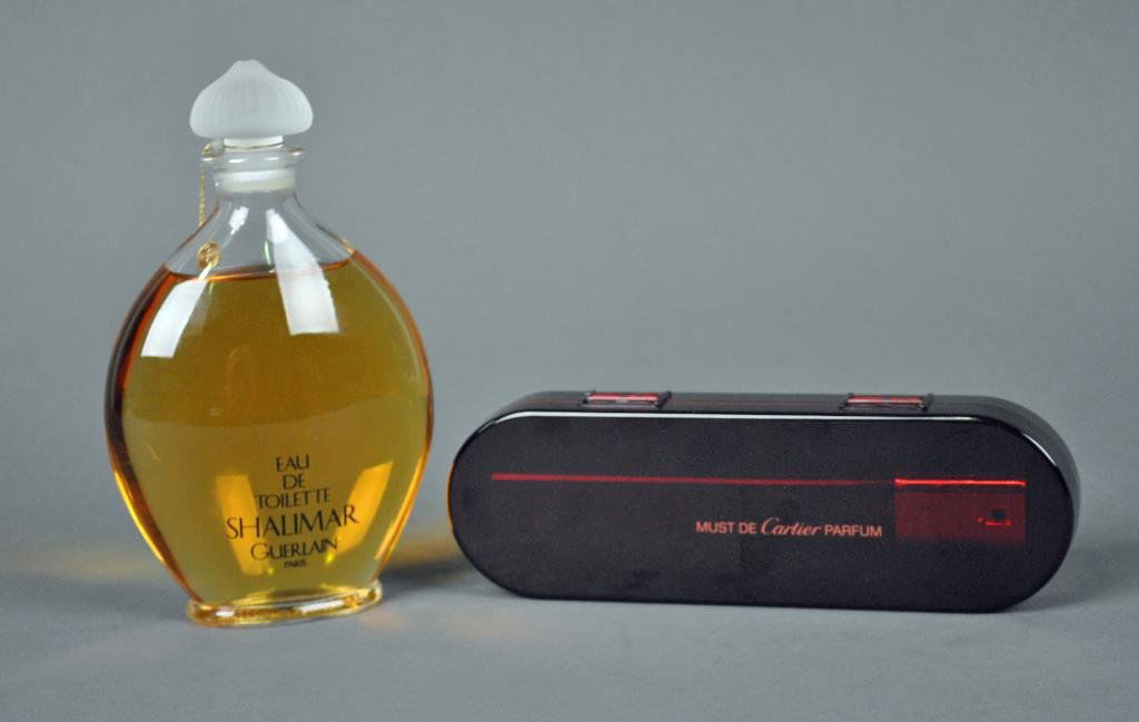 TWO DESIGNER FRAGRANCES: including a Guerlain Shalimar Eau de Toilette (8.5fl.oz), and a Must de Cartier Parfum (.8fl.oz) NO SHIPPING.