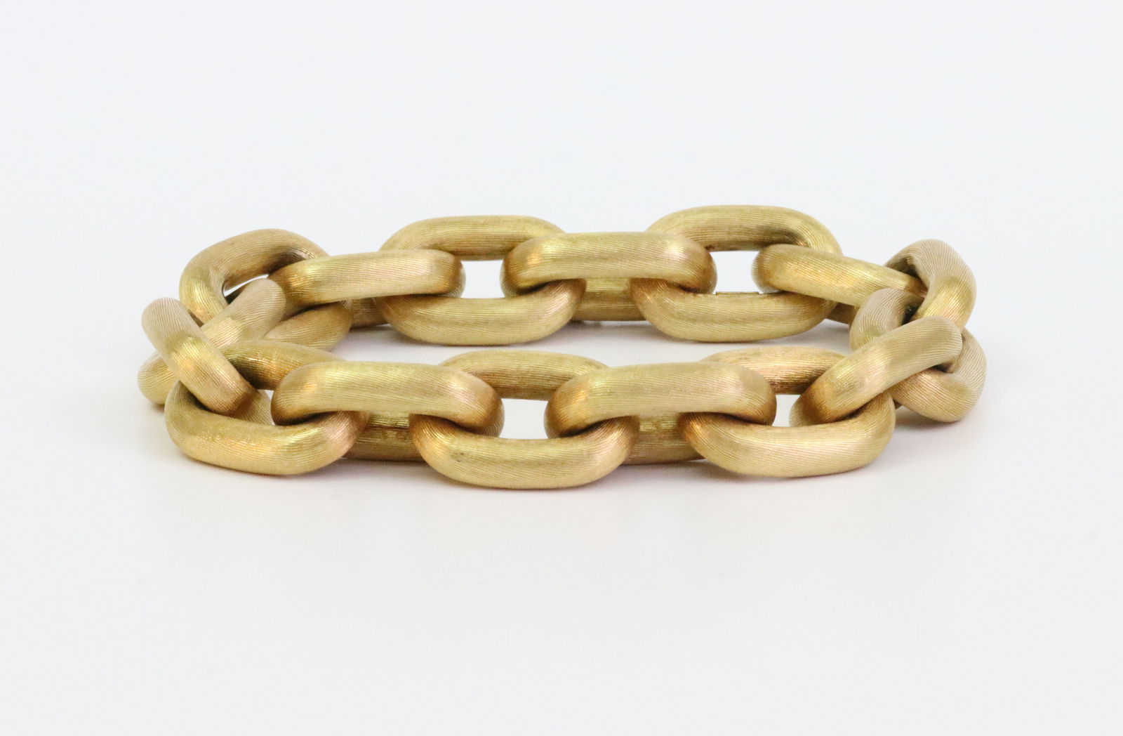 LARGE ITALIAN 18K CABLE LINK BRACELET, 72.7GMS.: designed in large oval (15.7x23.7mm) links, hallmarks include 750, GB and 13 VI for Giovanni Balestra & Figli, Venice, in yellow textured gold, length 9.2in., hinged link closure with safety, 72.7gms.