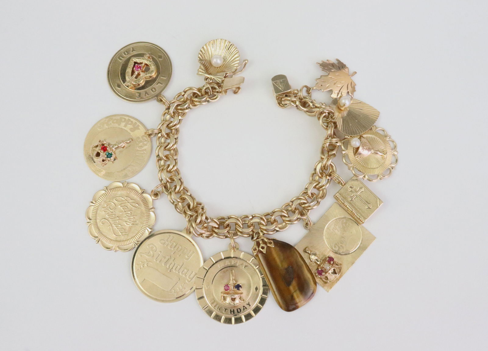 14K CHARM BRACELET WITH (11) GOLD CHARMS, MOST 14K (1 of 2)