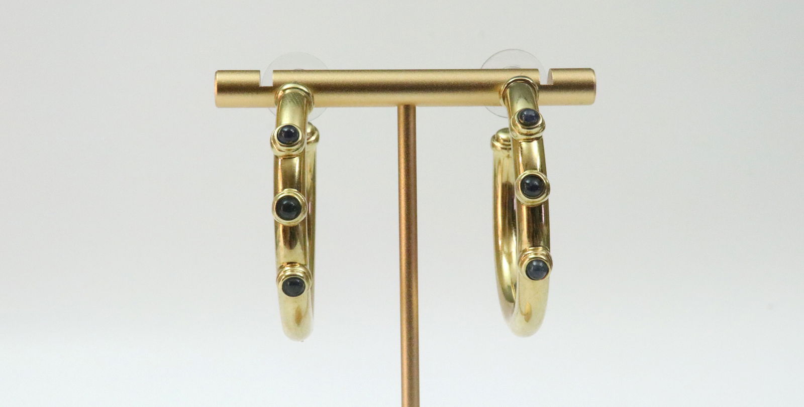 PAIR ITALIAN 18K CABOCHON SAPPHIRE HOOP EARRINGS: each comprising 3 bezel-set sapphires, in yellow gold, stamped 750, and with Italian hallmark 409 AR (Arezzo), 1.6in., gross weight 17gms. (no earring backs), Opening Bid $1100
