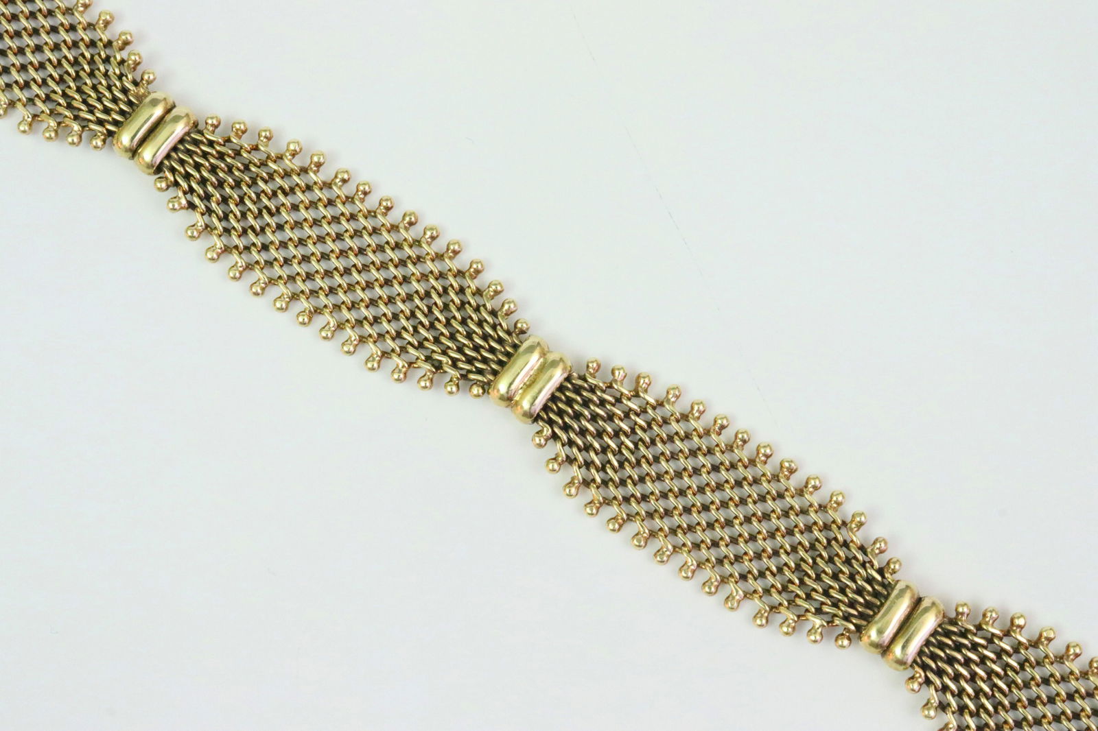 ITALIAN 14K FANCY MESH LINK BRACELET: with bead trim, width 14mm, length 7.5in., stamped 'Italy 14K', double safety, 20.1gms., Opening Bid $1100
