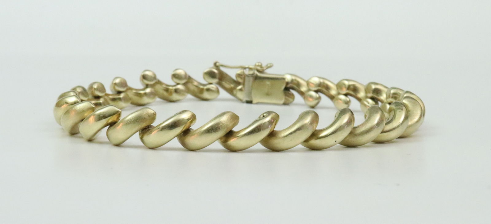 14K SAN MARCO LINK BRACELET: width 7mm, length 8.5in., stamped 14K, safety catch, 17.2gms., Opening Bid $900