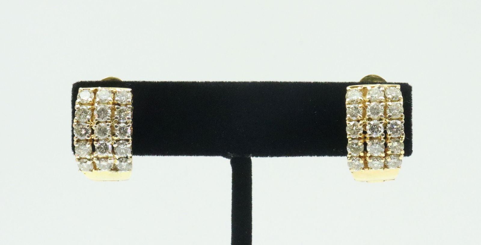 PAIR 14K DIAMOND HOOP EARRINGS: each set with 15 round diamonds approx. 1.50ctw, total diamond weight for the pair approx. 3.00ctw, in yellow gold, stamped ?14K MJ', latch back closures, .7in., gross weight 11.2gms., Opening Bid