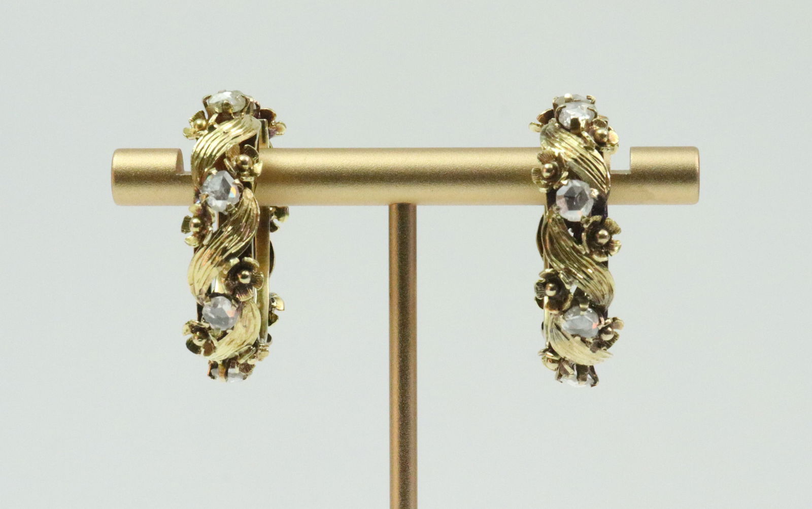 14K ROSE CUT DIAMOND HOOP EARRINGS: the pair set with 16 rose cut diamonds approx. 2.50ctw, in yellow gold with leaf and floral design, test 14K, leverback closures, 1.1in., gross weight 14.2gms., Opening Bid $700