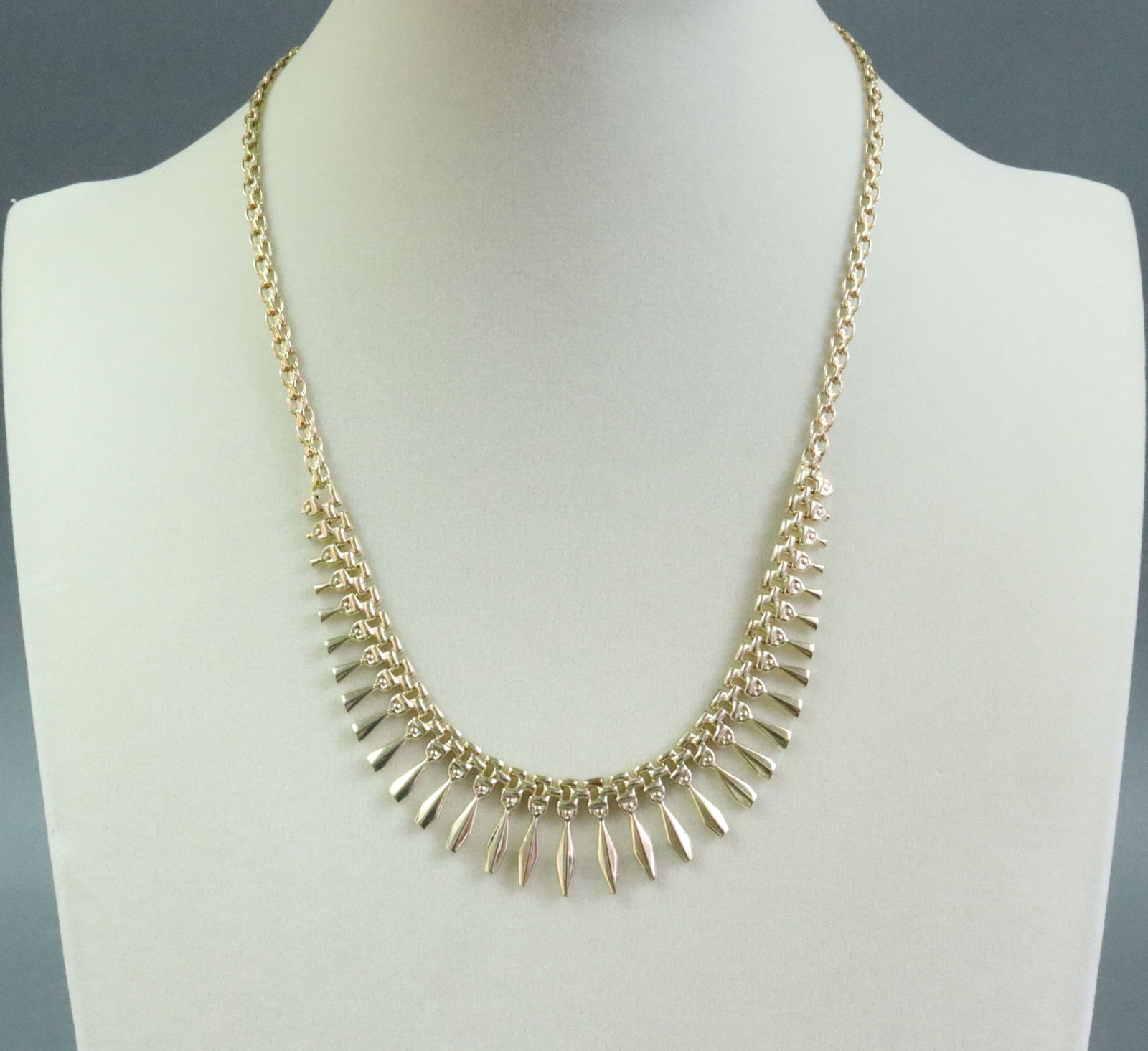 ITALIAN 14K ETRUSCAN STYLE NECKLACE: stamped 'Italy 585', graduated drops from 2-13mm, length 16.75in., 11.2gms., Opening Bid $500