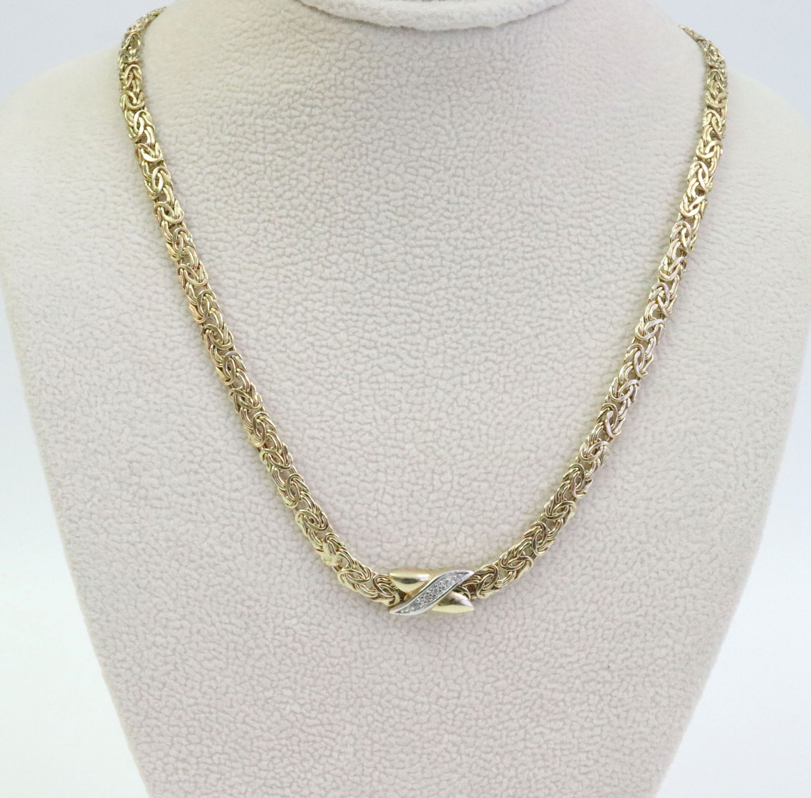 14K BYZANTINE NECKLACE: by Danbury Mint, with demure integrated bicolor X-form slide pendant, accented with 4 pave-set diamonds, tests 14K, stamped 'Turkey 14K The Danbury Mint', width 4mm, length 18in., 8.8gms., Opening