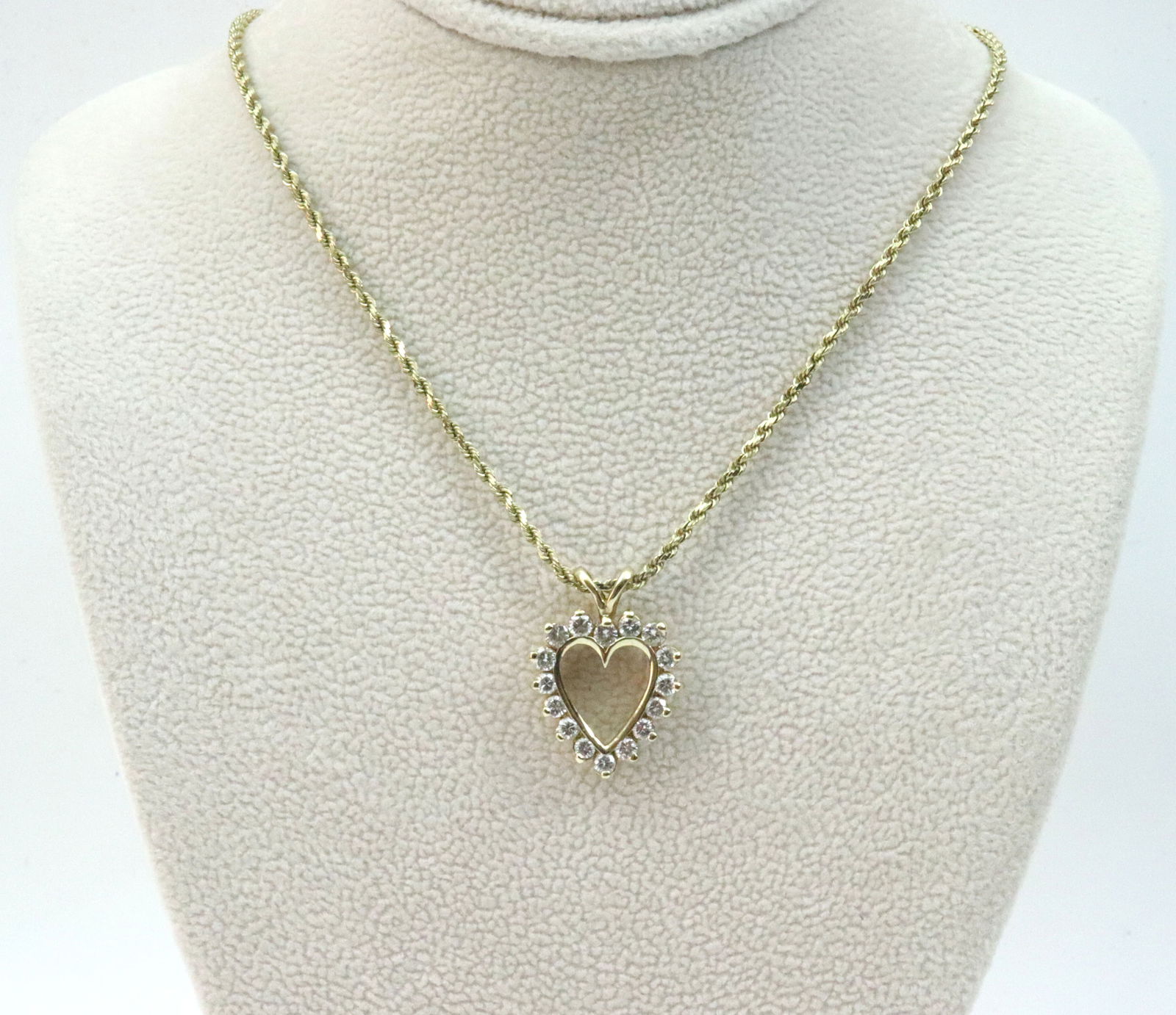 14K DIAMOND HEART PENDANT ON CHAIN: the heart form pendant set with 16 round natural diamonds approx. 0.75ctw, 16x15mm, on 16" rope link neckchain (pendant needs a little maneuvering to remove from chain), each in yellow gold stamped