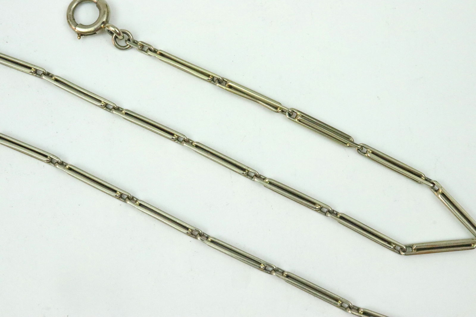 14K BAR LINK WATCH CHAIN: in white gold, stamped and tested 14K, 9.7gms., 14.25in., Opening Bid $400