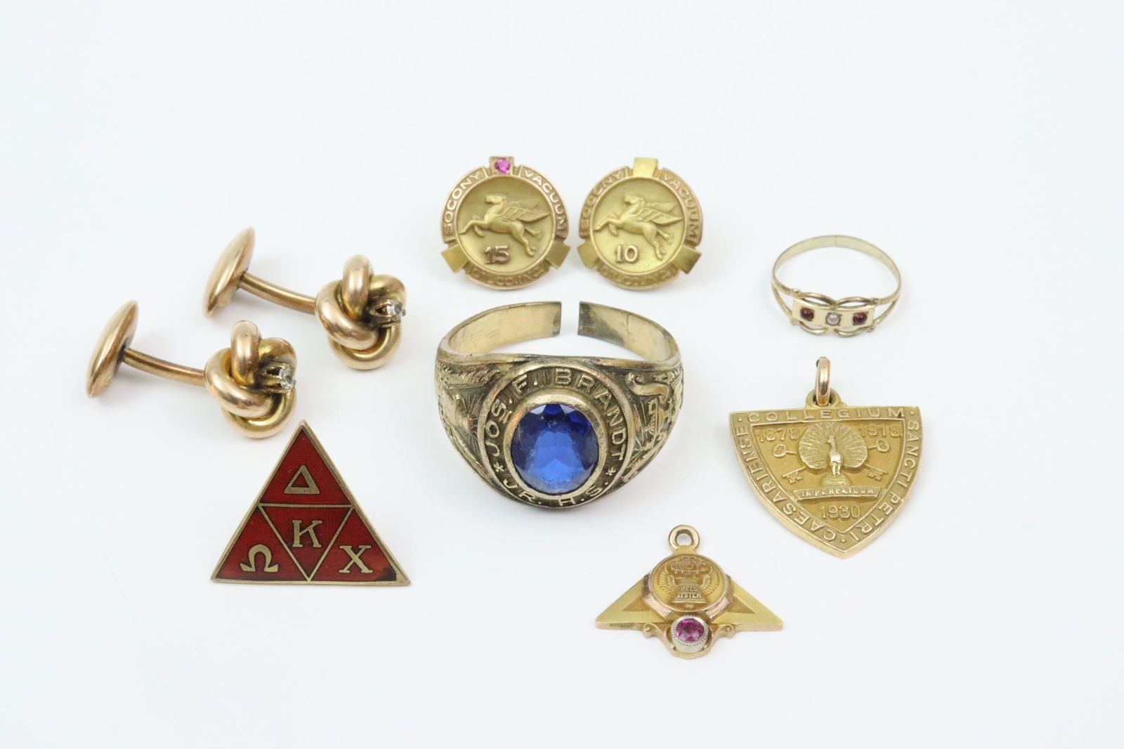 (8) PIECE 10K GOLD JEWELRY GROUP INCL. SCRAP: including a pair of (11mm) love knot cufflinks with accent diamond (one with solder remnant at attachment point), an as-is 1969 blue spinel high school ring (shank split, well scuffed), 2